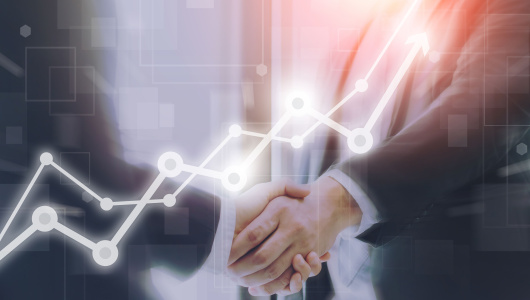 Businessman making handshake with a businesswoman on futuristic technology connection shape motion blur background with graph and chart rise up.Greeting and dealing business success concepts.
