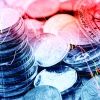 Pile and a stack of coins with technical chart of financial instruments. A concept about currency trading or investing which investors must analyse and make the right decision for optimal profits.