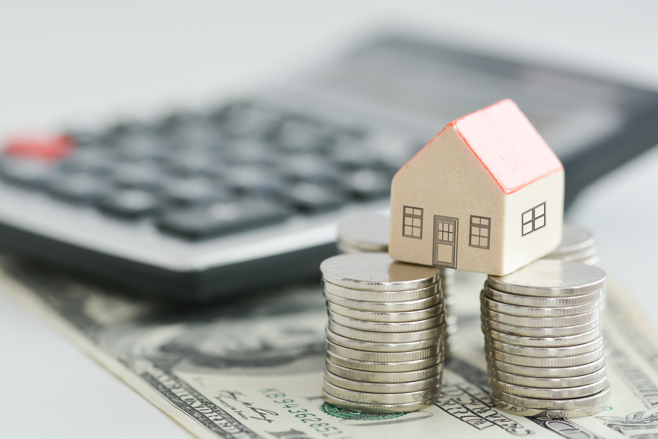 House on money pillars suggesting property investment
